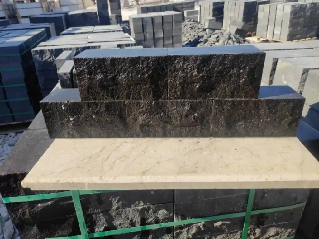 Hand-cut basalt paving blocks with a rustic split-face finish for historic cobblestone driveways.