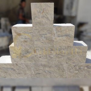 White Cobble Stones. These cobblestone garden edging in white color and split-face surface. Cut from limestone. Available across Arizona, Phoenix, the USA. Limestone manufacturers.