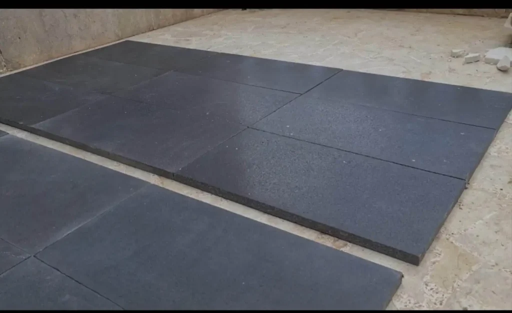 UV-resistant black basalt slab designed to withstand extreme heat without fading or cracking.