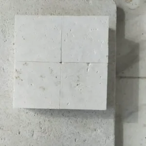 Luminous white natural stone block paving with a clean sawn finish for a bright, modern patio.