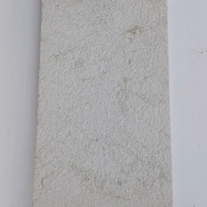 High-traction white stone driveway pavers with a uniform bush hammered finish for maximum tire grip and safety.