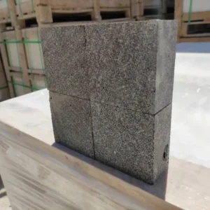 Dark natural finish basalt cobblestones showing organic textures and deep charcoal colors for garden paving.