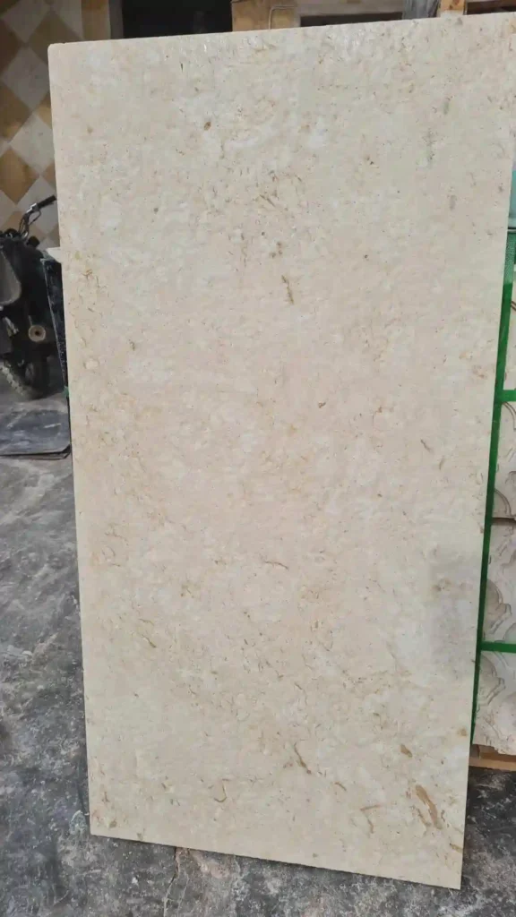 Close-up of the rough textured finish on white outdoor floor tiles for non-slip safety in wet areas