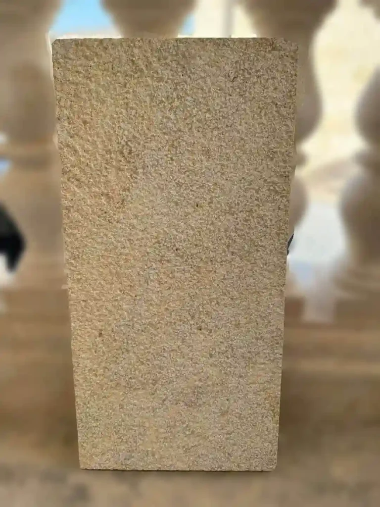 Large format yellow limestone patio tiles in a warm honey-gold palette for an inviting exterior