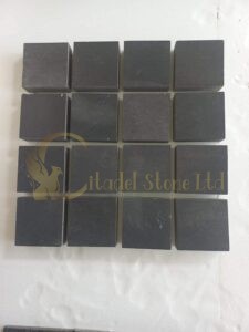 Black cobblestones. Black cobbles in a natural cut.