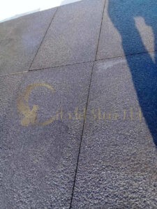 Basalt tiles with bush hammer finish. Ideal for exterior applications in the United States.