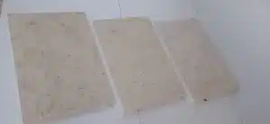 White limestone tiles around a pool