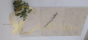 Applying sealer to white limestone pavers