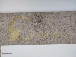 Team installing limestone pavers