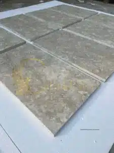 Textured limestone pavers on a pool deck