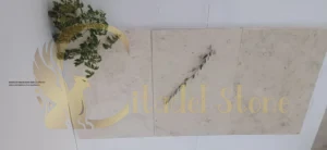 Variety of natural stone slabs in different colors and patterns in a warehouse