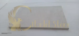 Modern kitchen with a large island and honed cream limestone floor tiles