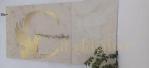 Worker inspecting stone slab quality