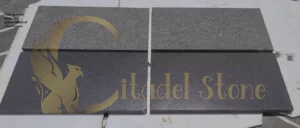 Close-up of the dense, non-porous surface of a basalt paver