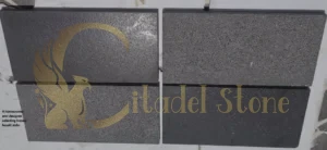 A homeowner and designer selecting honed basalt slabs