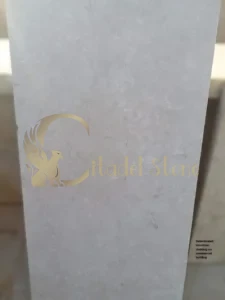 Delaminated limestone cladding on commercial building