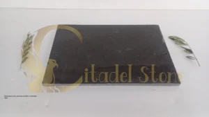 Honed stone surface absorbing soft light in a minimalist space