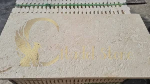 A close-up of the smooth, uniform texture of white limestone