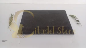 A spacious London loft featuring dark honed basalt flooring