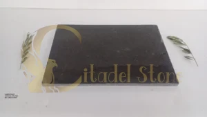 A polished basalt countertop with a high-gloss, reflective finish