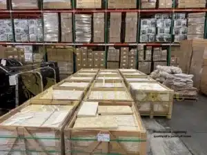 Professional inspecting quality of a pallet of stone