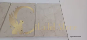 A bright, modern kitchen with white limestone flooring