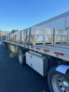 A delivery truck arriving at a construction site with stone
