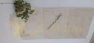 A contractor installing large-format limestone tiles in a retail space