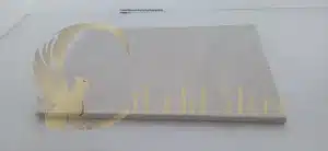 A sealed limestone floor surface showing liquid beading up