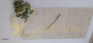 A close-up of a limestone floor with barely visible grout lines