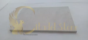 A close-up of the pristine surface of an in-stock white paver