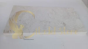 Contemporary driveway with white pavers