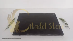 Close-up of polished basalt tile showing uniform dark gray surface and fine texture