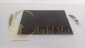 Macro photograph of sealed basalt tile surface showing dense fine-grained texture