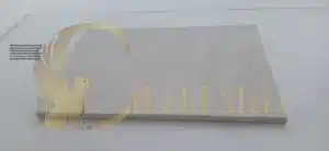 White travertine with characteristic porous structure and natural voids. Filled and honed finish smooths surface while retaining visible fossil traces and organic texture distinct from White Pearl's denser matrix.