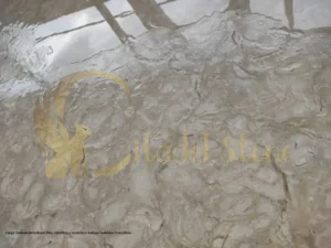 This image visually represents the core concept of unifying two living spaces with stone.