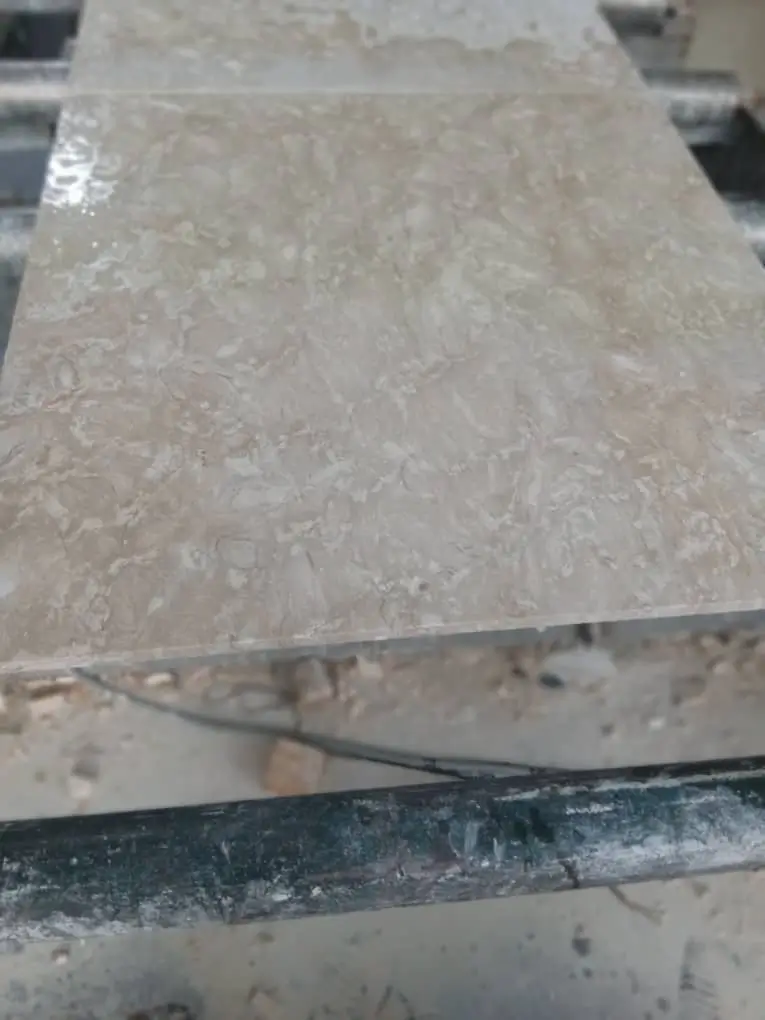 Close-up of a textured paving slab on a work table.