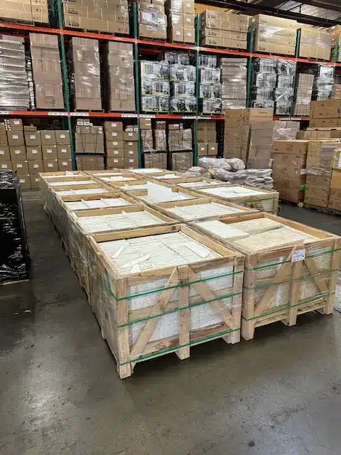 Natural stone warehouse featuring bluestone wholesale suppliers Arizona inventory stored in protective wooden crates.