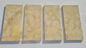 Four stone slabs for sale in Arizona arranged on a white background