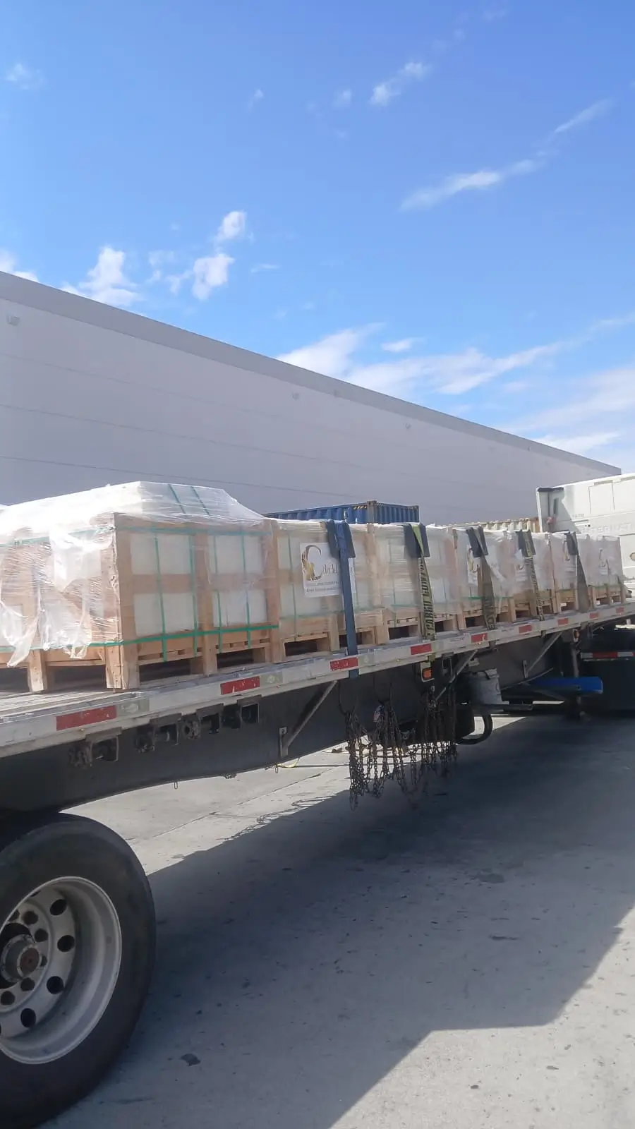 Loaded freight truck departing bluestone stone yard hours Arizona with secured natural stone crates