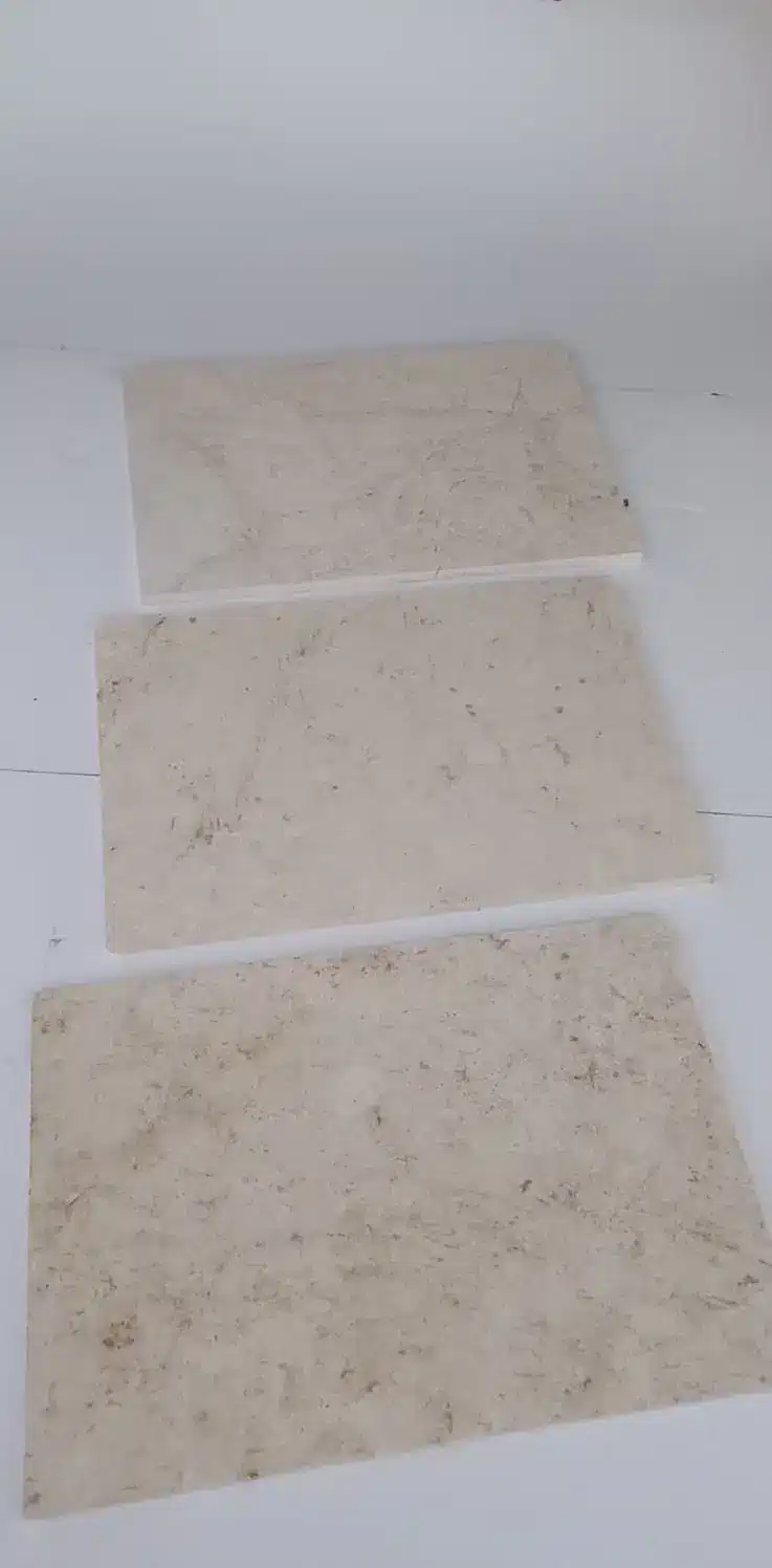 Assessing stone tile weight load Buckeye Three stone tiles displayed on a flat surface, highlighting weight load considerations.