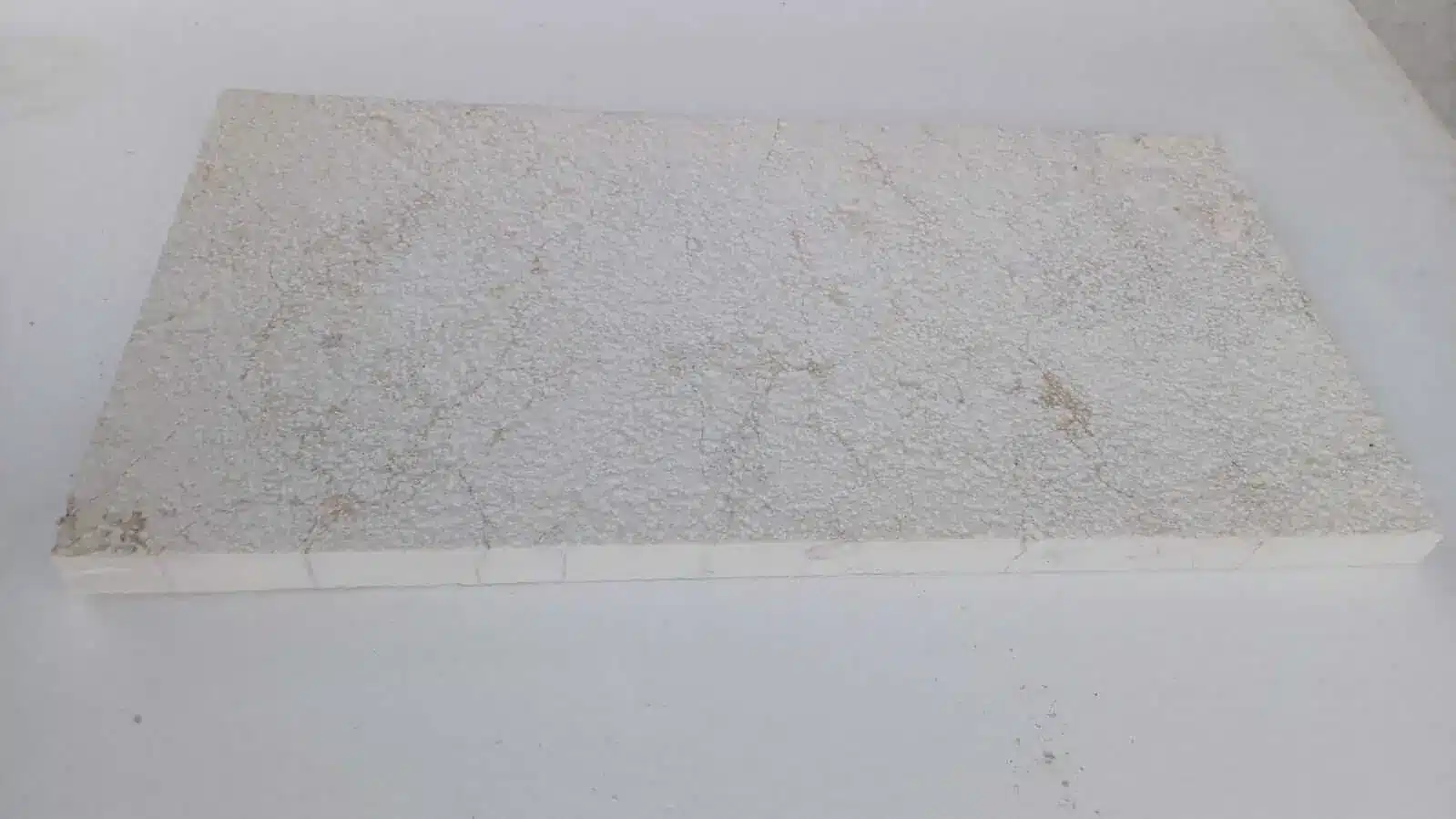 Close-up of encaustic stone tile Scottsdale showing a textured surface.