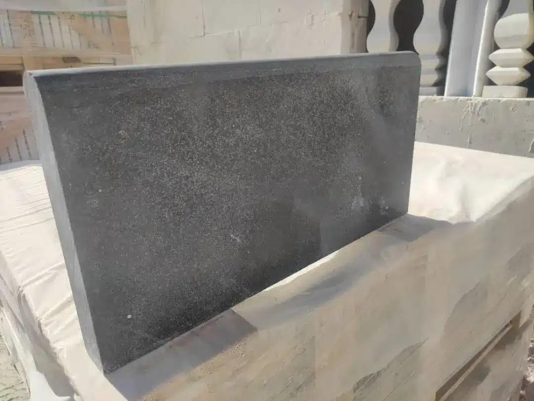 Stone Tile Expansion Joint Planning for Mesa Commercial Projects Stone tile expansion joints Mesa displayed on a wooden surface.