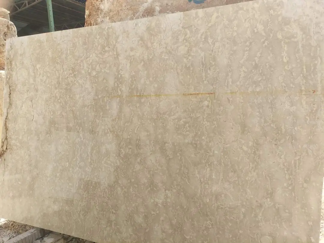 Large beige travertine slab with wavy patterns and texture.