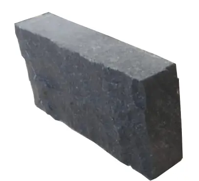 A dark gray stone block with a rough texture and cut edges.