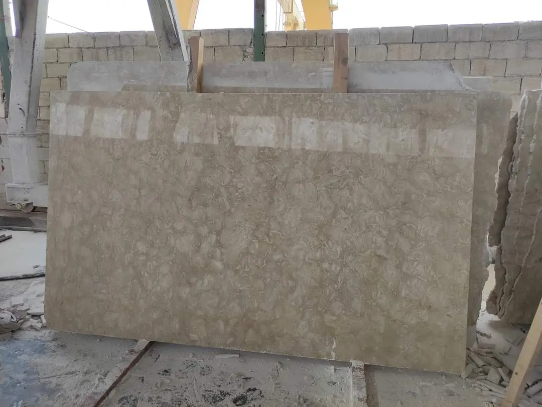 Polished travertine stone slabs displaying unique natural veining and texture patterns, pictured for how to install a flagstone patio.