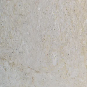 Close-up of the warm ivory veil drifting across white limestone