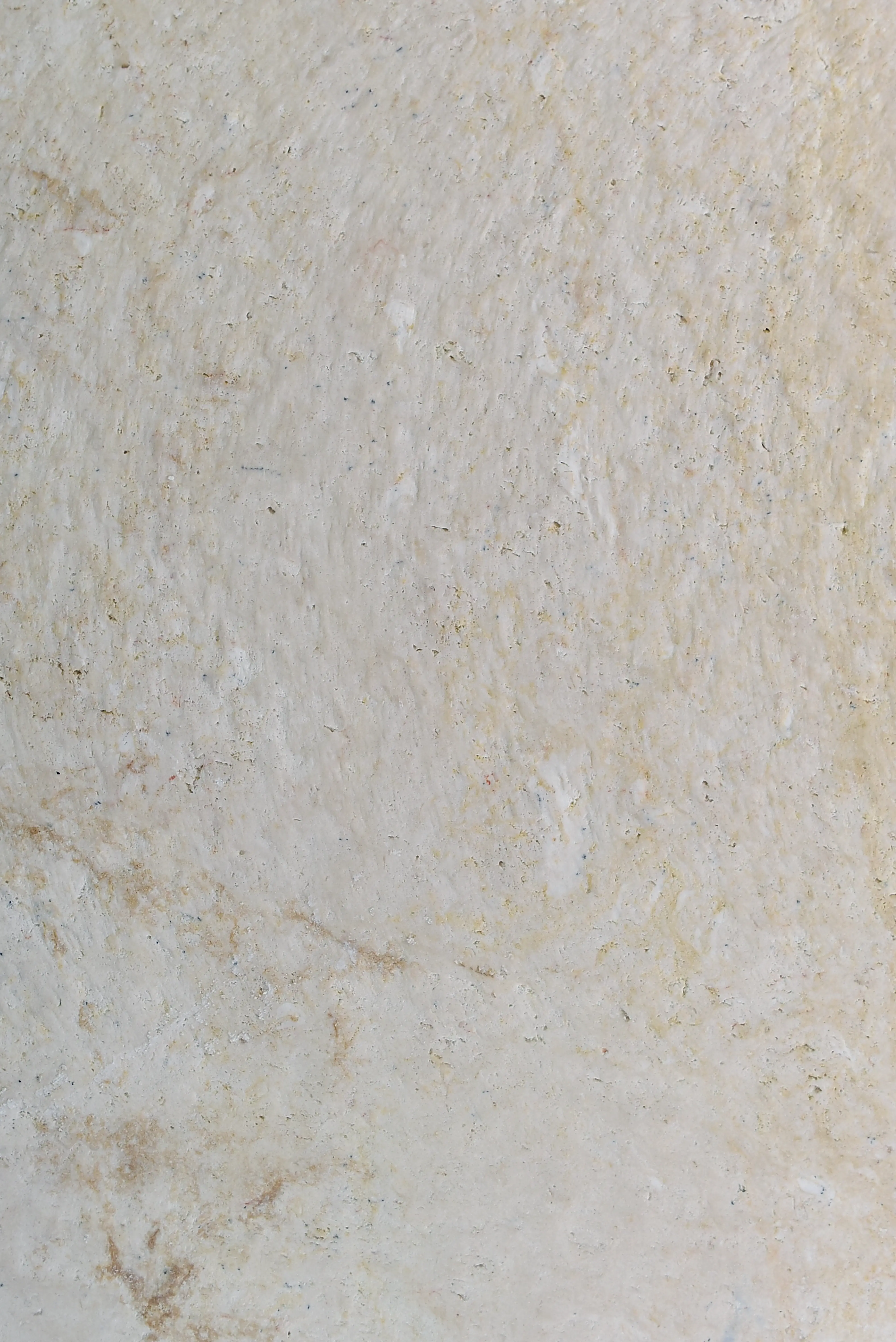 Close-up texture of beige natural stone pavers with subtle color variations, pictured for stone veneer for steps.