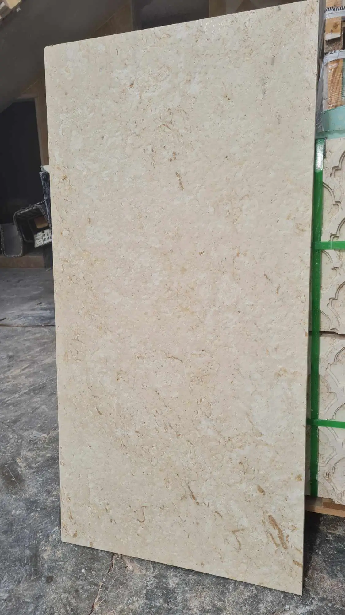 Detailed texture of beige travertine slabs with natural variations and earthy tones, a reference for travertine stone filler.