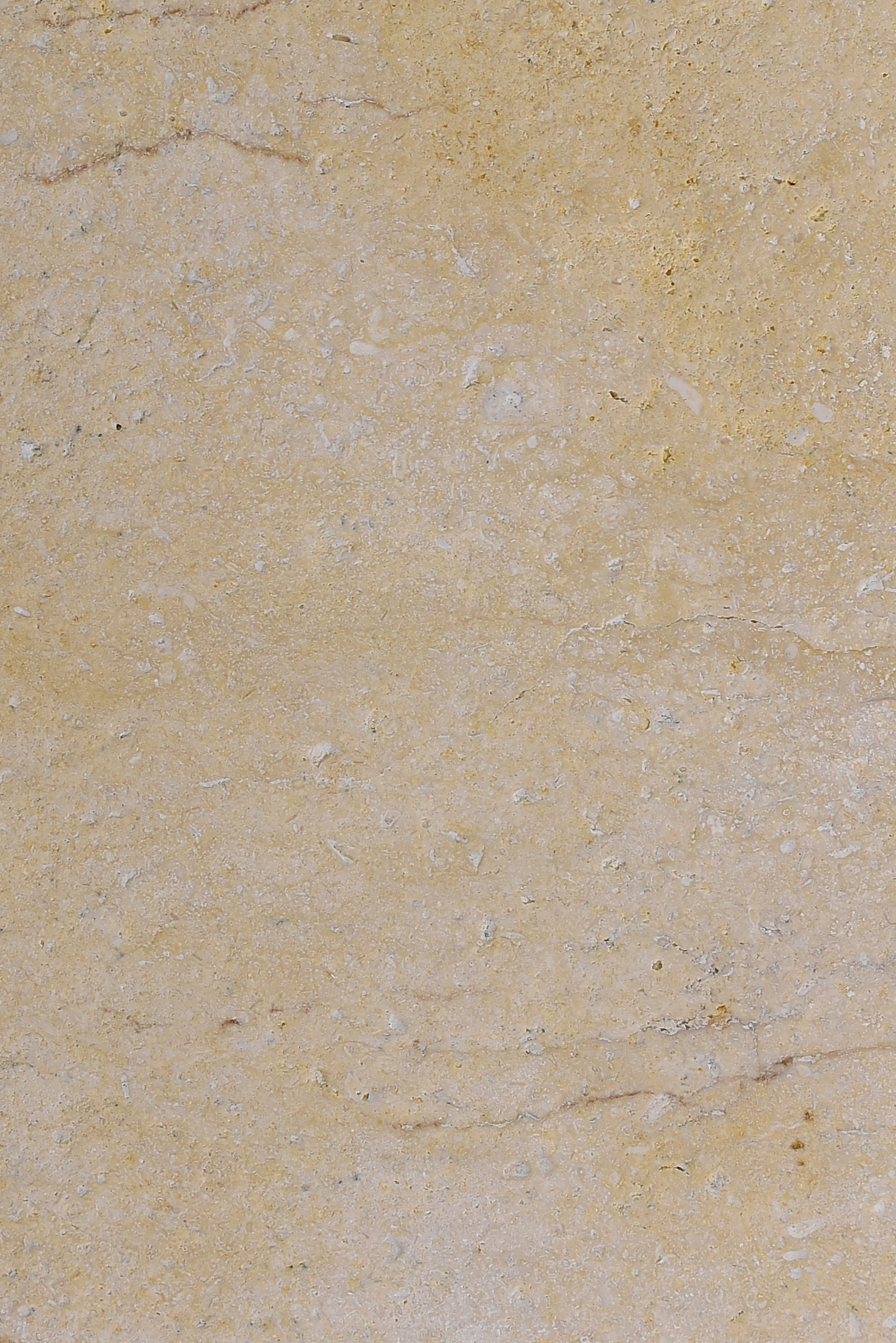 Close-up of beige travertine stone surface showing natural pores and veins for flooring, relevant to stone on masonry.